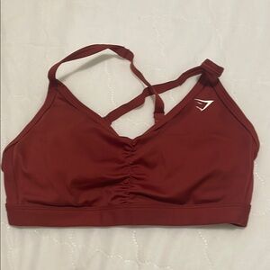 Gymshark Red Sports Bra with Crossed Straps and Ruched Front